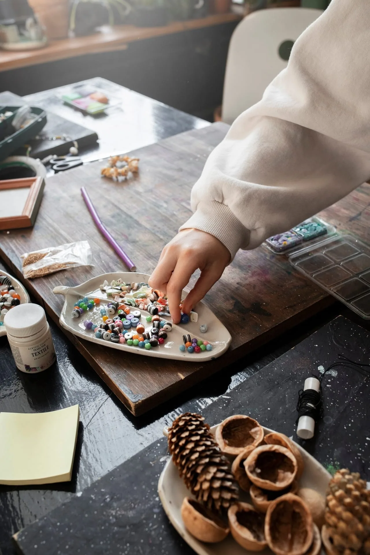 Handmade jewelry on workshop bench